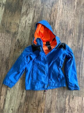 The North Face Blue Hooded Rain Jacket with Orange Lining